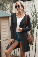 Black long sleeve longline cardigan with side slits and pocket detail