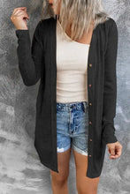 Black long sleeve longline cardigan with asymmetrical hem and pocket detail