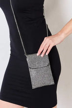 Black mini dress with Forever Link rhinestone mini crossbody bag