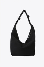 Black nylon crossbody bag with knotted strap and zipper closure