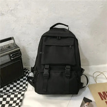 Black oxford cloth backpack with adjustable straps and multiple compartments