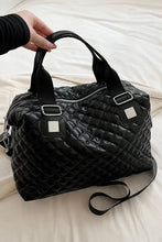 Black PU leather handbag with quilted duffle design and silver hardware