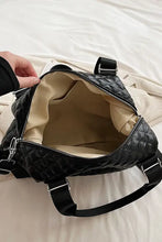 Black quilted faux leather handbag with silver hardware