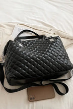 Black quilted faux leather handbag tote with adjustable strap