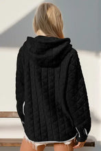 Black quilted hooded jacket with white contrast trim
