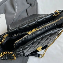 Black quilted leather shoulder bag with gold chain strap and clasp