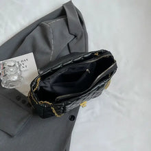 Black quilted leather shoulder bag with gold chain strap and clasp