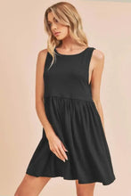 Sleeveless black babydoll mini tank dress with classic round neck
