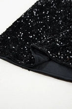 Black sequin mini skirt with sequined clutch bag and shiny lining