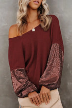 Burgundy off-shoulder ribbed knit top with sequin bell sleeve length
