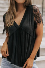 Black short sleeve lace babydoll top with ruffled hem and v-neckline