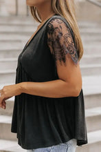 Black short sleeve lace babydoll top with ruffled hem