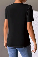 Black short sleeve t-shirt with heart sequin round neck design