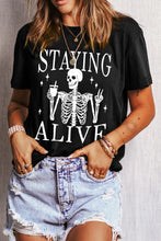 Black Skeleton Graphic T-Shirt and Light Blue Jeans for Women
