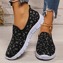 Black slip-on flat loafers with moon pattern and star design