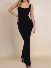 Woman in slit wide strap maxi dress with square neckline
