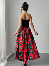 Black strapless floral tube maxi dress with red flowing skirt