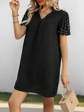 Black stretch polka dot puff sleeve dress with pearl embellishments