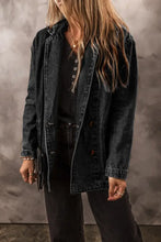 Black denim jacket with lace-up front, button-down closure, fringe details