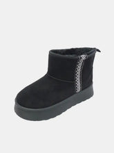 Black suede round toe platform boots with decorative stitching