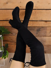 Black suede thigh high heeled boots for women