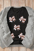 Black t-shirt with football bow pattern, gray cardigan, machine wash