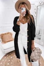 Black textured cardigan with gold buttons and long sleeve length