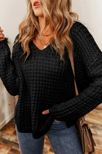 Black textured long sleeve sweater with openwork round neck