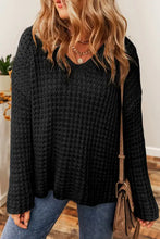 Black openwork round neck long sleeve sweater with textured design