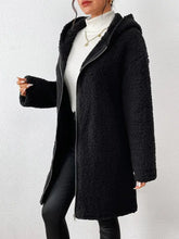Black textured sherpa hooded coat with long sleeves and pockets