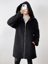 Black textured sherpa hooded coat with long sleeves and pockets
