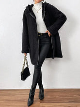 Black textured sherpa hooded coat with long sleeves and pockets