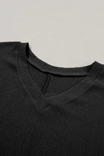 Black textured V-neck short sleeve top for women