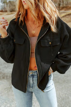 Black utility jacket with gold buttons, zipper, and various sleeve lengths