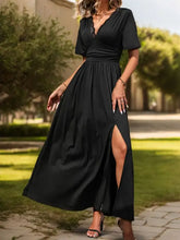 Black short sleeve dress with V-neck, ruched waist, and high slit
