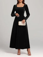 Black velvet square neck long sleeve dress with embellished clutch