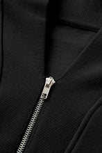 Black zip-up hoodie with silver zipper, ribbed texture, and full length joggers