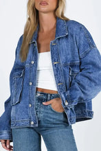 Blue acid wash denim jacket with button closure and oversized pockets