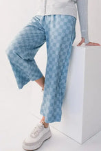 Blue and white checkered wide-leg velour jogger pants with tie-dye effect