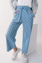 Blue and white checkered wide-leg velour jogger pants with drawstring and pockets