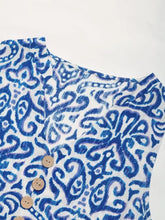 Blue and white paisley shirt with decorative wooden buttons
