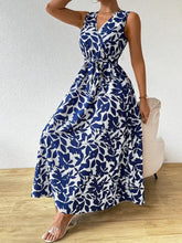 Printed surplice sleeveless maxi dress with blue and white leaf print
