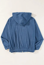 Blue corduroy hoodie jacket with drawstring hem, hood, and zipper closure