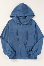 Blue corduroy hoodie with drawstring hood, zipper closure, and front pockets