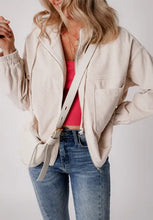 Blue corduroy hooded jacket with zipper, beige bomber style, white drawstrings, pockets