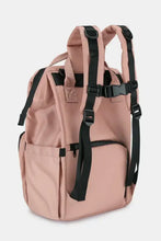 Blush pink nylon backpack bag with multiple compartments and chest buckle