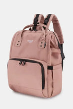 Blush pink nylon backpack bag with black accents and multiple compartments