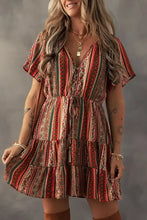 Boho multicolored striped dress with ruffled hem and brown leather boots