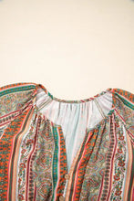 Boho multicolored paisley blouse with ruffled hem and boots