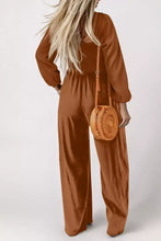 Boho smocked square neck wide leg jumpsuit with woven straw crossbody bag